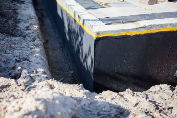 Professional Waterproofing technician working in Dansville, NY